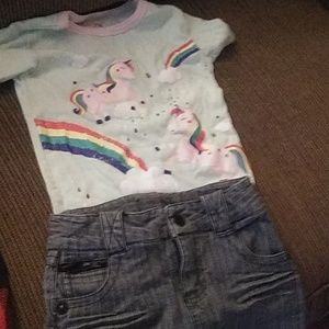 A unicorn top and jean skirt